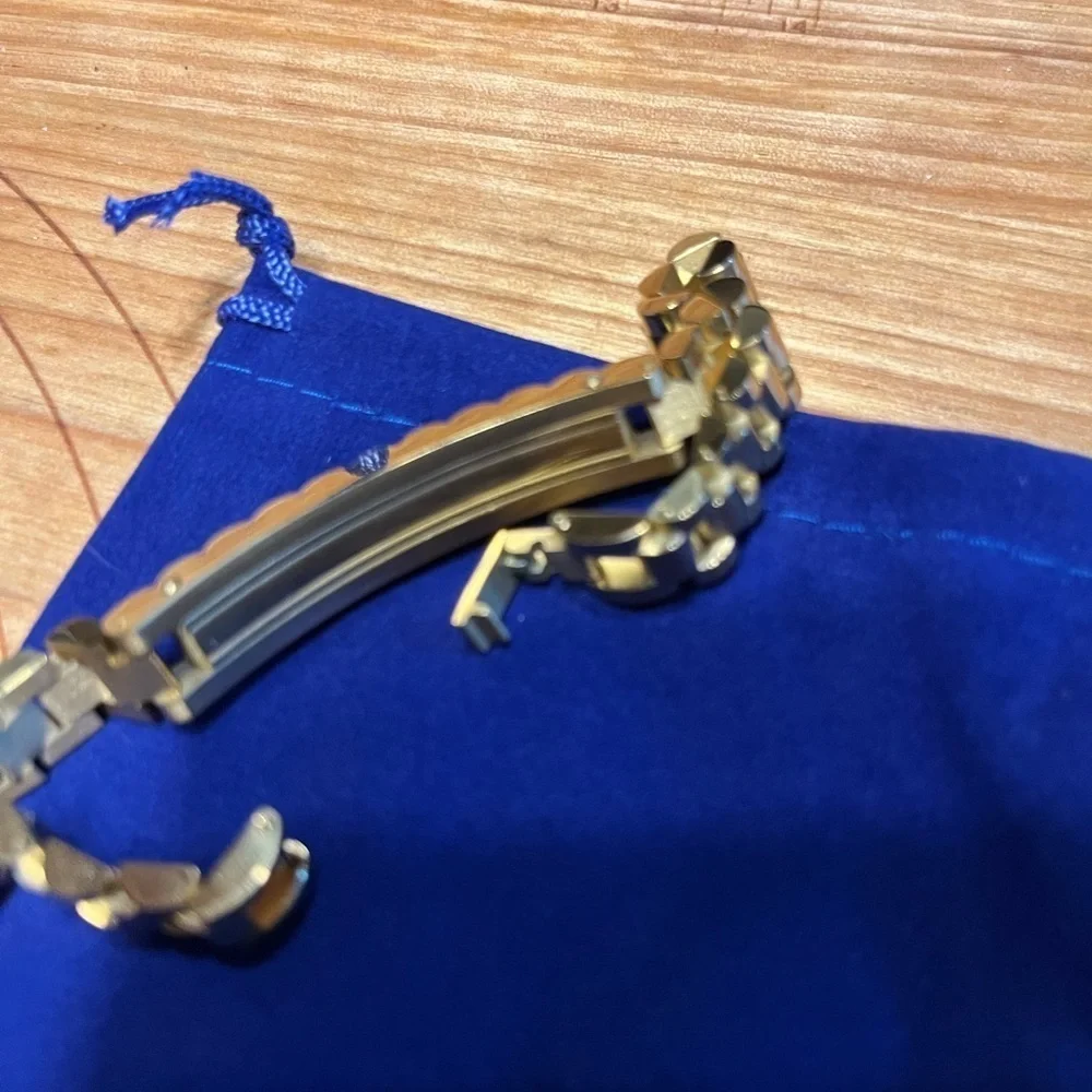 gold bracelet within crown on it. It is NOT a …. But your friends won’t know